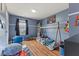 The Marvel-themed bedroom features hardwood floors, stylish decor, and abundant natural light at 2580 Bluewood Way, Plainfield, IN 46168