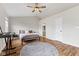 This spacious bedroom features hardwood floors, high ceilings, abundant natural light, and stylish decor at 2580 Bluewood Way, Plainfield, IN 46168
