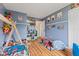 This superhero themed bedroom features hardwood floors, and stylish superhero decor at 2580 Bluewood Way, Plainfield, IN 46168