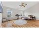 The bedroom features high ceilings, hardwood floors, abundant natural light, and a ceiling fan at 2580 Bluewood Way, Plainfield, IN 46168