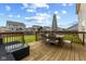 Relax on the deck with comfortable seating, perfect for enjoying the beautiful backyard view at 2580 Bluewood Way, Plainfield, IN 46168