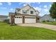 Attractive home showcasing a three-car garage, brick accents, and a basketball hoop at 2580 Bluewood Way, Plainfield, IN 46168