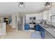Modern kitchen with stainless steel appliances, white subway tile backsplash, and stylish blue and white cabinetry at 2580 Bluewood Way, Plainfield, IN 46168
