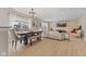 Open-concept living and dining area filled with natural light and featuring a large sectional sofa at 2580 Bluewood Way, Plainfield, IN 46168