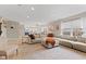 Bright living room featuring a large sofa, neutral colors, and an open layout at 2580 Bluewood Way, Plainfield, IN 46168