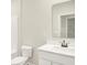 Neutral bathroom features a white vanity, toilet, and mirror at 2733 Bo W St, Plainfield, IN 46168