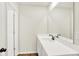 Bright bathroom featuring a large mirror over the vanity with a white countertop and grey cabinets at 2733 Bo W St, Plainfield, IN 46168