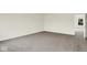 Bedroom with neutral carpet, bright windows, and an adjacent door at 2733 Bo W St, Plainfield, IN 46168