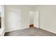 A cozy bedroom featuring neutral carpet, two doors, and a bright window at 2733 Bo W St, Plainfield, IN 46168