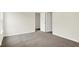 This is a view of an empty bedroom with neutral walls and carpet, plus a doorway at 2733 Bo W St, Plainfield, IN 46168