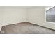 This empty bedroom features neutral walls, soft carpet, and a bright window at 2733 Bo W St, Plainfield, IN 46168