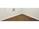 A room corner features wood-look vinyl flooring and utility connections at 2733 Bo W St, Plainfield, IN 46168