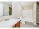 Well-lit bathroom features a vanity, toilet, and a shower-tub combination with neutral finishes at 2834 Wolfgang Dr, Indianapolis, IN 46239
