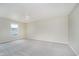 Bright bedroom features a ceiling fan, plush carpeting, and a large window offering ample sunlight at 2834 Wolfgang Dr, Indianapolis, IN 46239