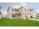 Attractive two-story home featuring a well-kept lawn and neutral siding at 2834 Wolfgang Dr, Indianapolis, IN 46239