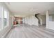 Combined living and kitchen area with updated floors and ample lighting at 2834 Wolfgang Dr, Indianapolis, IN 46239