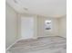 Bright living room featuring neutral paint and wood-look flooring at 2834 Wolfgang Dr, Indianapolis, IN 46239