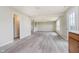Spacious living room boasts new laminate floors, abundant natural light, and an open concept design at 2834 Wolfgang Dr, Indianapolis, IN 46239