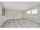Open living space with updated flooring, a ceiling fan, and bright, neutral paint at 2834 Wolfgang Dr, Indianapolis, IN 46239