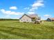 Well-maintained house with large front yard and mature landscaping at 3150 Green Brook Ln, Frankfort, IN 46041