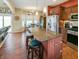 Kitchen area with island, stainless steel appliances, and adjacent dining nook at 3150 Green Brook Ln, Frankfort, IN 46041