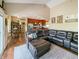 Open-concept living room with vaulted ceiling, hardwood floors, and a spacious sectional sofa at 3150 Green Brook Ln, Frankfort, IN 46041