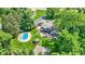 Aerial view featuring backyard with pool, basketball court, gazebo, patio, and lush landscaping at 3528 E 116Th St, Carmel, IN 46033