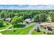 Aerial view of a secluded home surrounded by lush greenery and manicured lawns at 3528 E 116Th St, Carmel, IN 46033