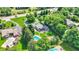 Stunning aerial view of a large home with a pool, lush landscaping, and a winding driveway, offering privacy at 3528 E 116Th St, Carmel, IN 46033