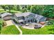 Back exterior showing fire pit, hot tub, seating, brick patio and well maintained landscaping at 3528 E 116Th St, Carmel, IN 46033