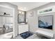Stylish bathroom featuring a modern vanity, herringbone floors, and an adjacent bedroom at 3528 E 116Th St, Carmel, IN 46033