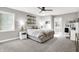 Comfortable bedroom featuring neutral tones, plush carpeting, and ensuite bathroom access at 3528 E 116Th St, Carmel, IN 46033