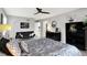 Charming bedroom featuring a sitting area, a dresser, and warm, inviting decor at 3528 E 116Th St, Carmel, IN 46033