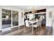 Bright dining area with modern chandelier, and easy access to the outdoor patio area at 3528 E 116Th St, Carmel, IN 46033