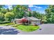 Attractive single-story stone home with landscaped yard, mature trees and three car garage at 3528 E 116Th St, Carmel, IN 46033