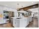 Bright kitchen with stainless steel appliances, a central island with bar seating, and modern lighting fixtures at 3528 E 116Th St, Carmel, IN 46033