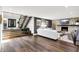 Spacious living room with hardwood floors, modern staircase, and an open layout perfect for entertaining at 3528 E 116Th St, Carmel, IN 46033