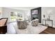 Cozy living room features a fireplace, plush seating, and a bright window at 3528 E 116Th St, Carmel, IN 46033