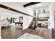Spacious living room features hardwood floors, exposed beams, pool table and grand piano at 3528 E 116Th St, Carmel, IN 46033