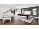 Elegant living room features a grand piano, pool table, and chic decor at 3528 E 116Th St, Carmel, IN 46033