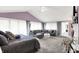 Spacious main bedroom with a sitting area, plush carpeting, and lots of natural light at 3528 E 116Th St, Carmel, IN 46033
