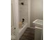Cozy bathroom features a bathtub with a modern shower head and white marble tile at 3626 N Denny St, Indianapolis, IN 46218