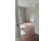 Bright bedroom with hardwood floors ready for your design touches at 3626 N Denny St, Indianapolis, IN 46218