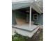Exterior view of a covered porch area with building materials, offering potential for customization and outdoor living space at 3626 N Denny St, Indianapolis, IN 46218