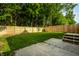 Grassy backyard with a new wooden fence and a newly constructed deck that includes steps at 3818 Fetlock Dr, Indianapolis, IN 46227
