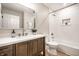 Modern bathroom featuring tub, vanity, and stylish mirror at 3818 Fetlock Dr, Indianapolis, IN 46227