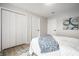 Bright bedroom with ample closet space, modern decor, and luxury vinyl flooring at 3818 Fetlock Dr, Indianapolis, IN 46227