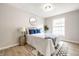 Cozy bedroom with soft natural lighting, stylish accents, and wood-style flooring at 3818 Fetlock Dr, Indianapolis, IN 46227