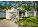 Charming single-story home with well-maintained lawn and inviting front entrance with a drive way and garage at 3818 Fetlock Dr, Indianapolis, IN 46227