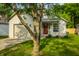 Charming single-story home with well-maintained lawn and inviting front entrance with a drive way and garage at 3818 Fetlock Dr, Indianapolis, IN 46227